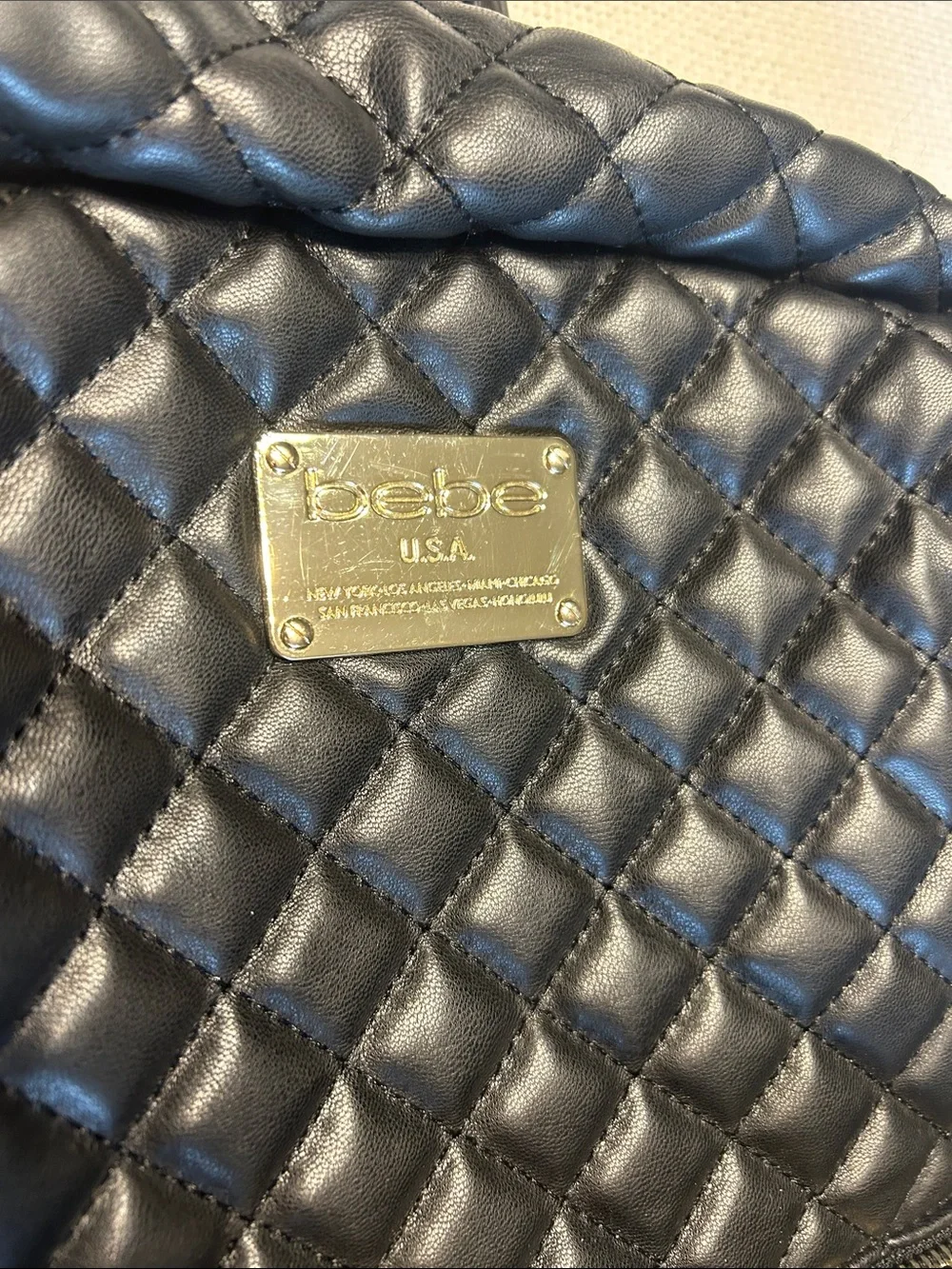 bebe Black Quilted Leather Backpack with Gold Plate